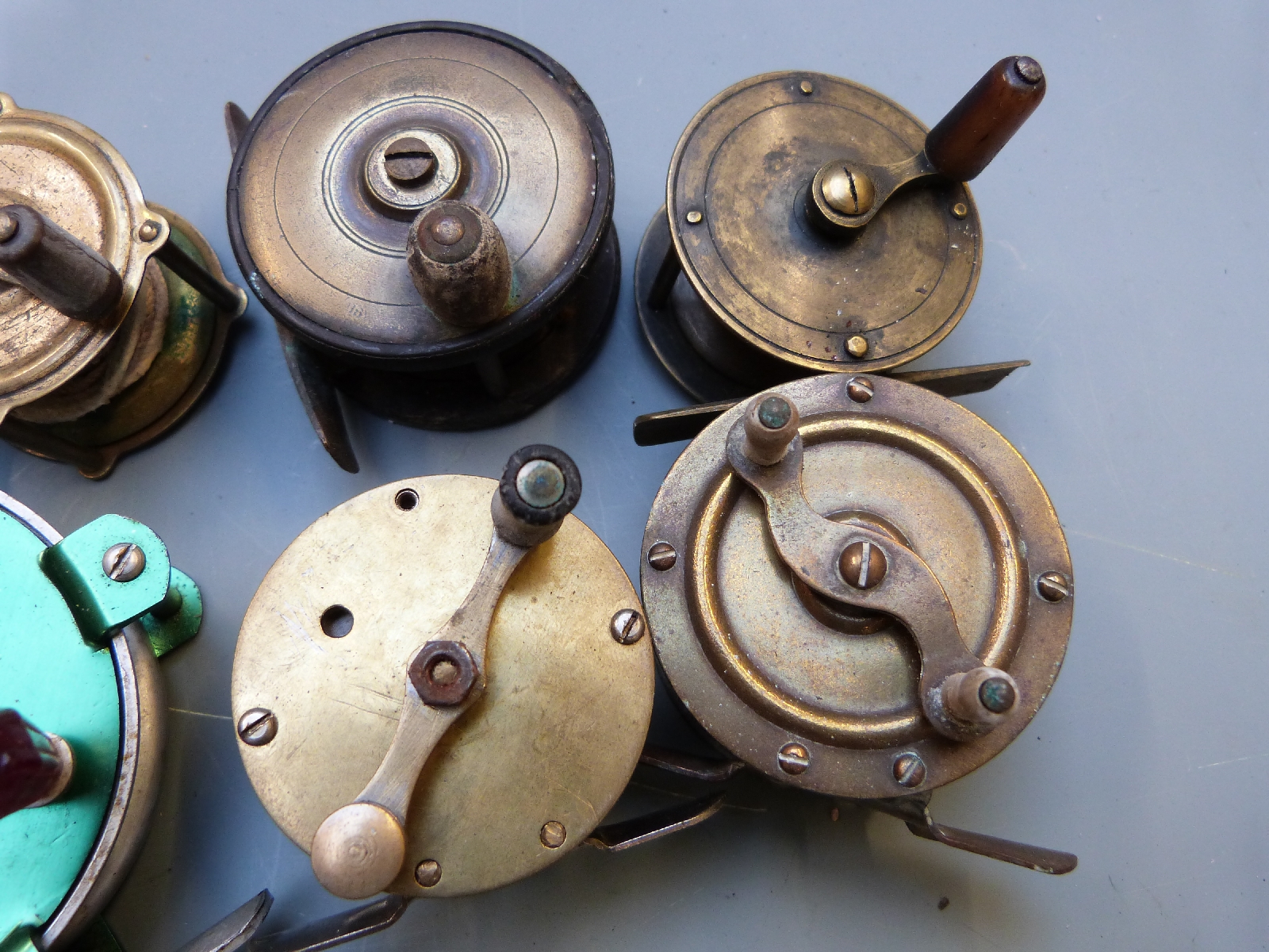 Collection of twenty six anonymous 19th/20thC brass fishing reels including Abu Delta 3 fly reel, - Image 2 of 4