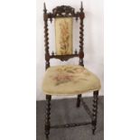 Small upholstered hall chair with ornately carved back.