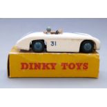Dinky Toys diecast model Cuningham C-5R Road Racer with white body, pale blue hubs and driver, tan