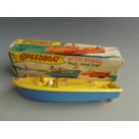 Marx Speedboat battery operated High Speed Craft with yellow deck and blue hull, in original box.