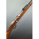Mauser 1871/84 bolt action rifle with inpressed marks to the stock, sling suspension mounts, steel