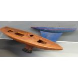 Two wooden model sailing boat/ pond yacht hulls, largest 135cm long.