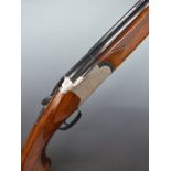 The Silver Snipe 12 bore over and under ejector shotgun with engraved scenes of birds to the lock