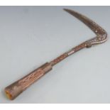 A 19thC Afghan Lohar war axe or pick with curved blade, inlaid wooden grip  and Damascened blade,