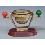 Small ship's nautical compass with Nelson's balls, on wooden base, width 23cm