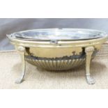 A plated food warmer with revolving lid, raised on lion pad feet