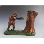 Novelty cast iron mechical money bank with a figure shooting the coin into a tree with pop-up