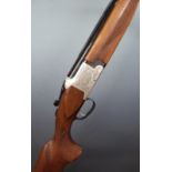 Winchester Model 91 12 bore over and under ejector shotgun with engraved lock, trigger guard, top