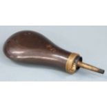 Copper and brass powder flask with embossed decoration to one side, 20cm long.