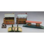 Five Hornby and similar 0 gauge model railway buildings and accessories comprising two signal boxes,