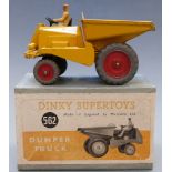 Dinky Supertoys diecast model Dumper Truck with yellow body and red hubs, 562, in original box.