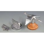 Morgan stork aluminium car mascot on turned wooden base, length 16cm together with a winged M