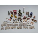 Over 50 Britains and similar farmyard animals, figures and accessories.