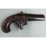 Colt No. 2 .41 rimfire derringer pistol with shaped and chequered grip, engraved decoration,