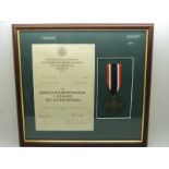 German Third Reich Nazi War Merit Cross with Swords medal, framed with certificate