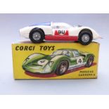 Corgi Toys diecast model Porsche Carrera 6 with white body, red bonnet and doors, blue engine cover,