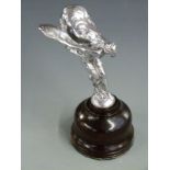 Rolls Royce Spirit of Ecstasy car mascot, on turned wooden base, overall height 18.5cm