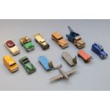Twelve Dinky Toys diecast model vehicles including Loudspeaker Van, Dinky Service Commer, Kodak