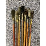 Seven wooden and brass gun cleaning rods.