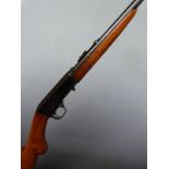 Browning .22 short semi-automatic rifle with semi-pistol grip, adjustable sights and 19 inch barrel,