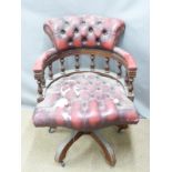 A vintage red leather Chesterfield captain's or office swivel chair