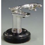 Jaguar car mascot mounted on chrome and ebonised base, overall height 14cm