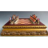 Franklin Mint Napoleonic War chess set with figural pieces, in original fitted wooden box.