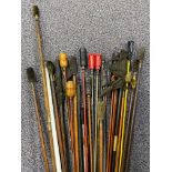 Thirty various wooden and metal gun cleaning rods.