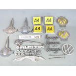 Collection of motoring badges including Morris, Dolomite 1300, American aluminium Greyhound bus,