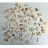 A collection of cap badges, mainly British Infantry regiments including Light Infantry,