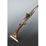 North African, Afghan or similar flintlock hammer action jezail with ornately decorated stock inlaid