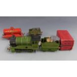 Hornby 0 gauge clockwork locomotive and tender in box and tanker.