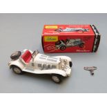 Schuco Micro Racer clockwork diecast model Mercedes Typ SSK (1928) with white body, red seat, and