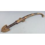 A 19thC North African Moroccan tribal jambiya in brass and copper sheath, L44cm