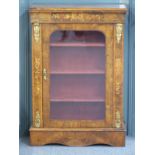 A 19thC inlaid walnut glazed pier cabinet with ormolu mounts, three shelves and velvet lined