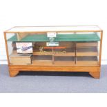 An early/mid 20thC glazed oak haberdashery/shop fitting display cabinet with interior waterfall