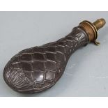 Steel and brass powder flask with embossed rope and acanthus leaf decoration to both sides, 21cm