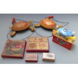 A small collection of children's toys and games comprising two Mobo metal pull-along Toy-toise,