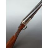 Thomas Wild 12 bore side by side ejector shotgun with engraved scene of dogs to the lock, engraved