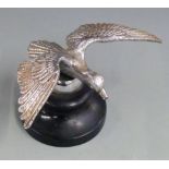 Vintage car mascot formed as a bird in flight, the base marked Desmo, on ebonised base, wingspan