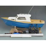 Scratch built wooden remote controlled boat with planked deck, blue painted hull and HiTec Ranger II