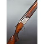 Miroku 12 bore over and under ejector shotgun with engraved lock and top plate, chequered semi-