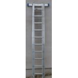 Zarges Zaletta triple extending aluminium ladder with stablising bar to base
