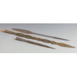 Three African tribal spears including a barbed fish spear, one possibly made from a stair rod etc