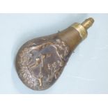 Sykes copper and brass powder flask with embossed shooting scene decoration to both sides, 18cm