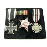 German WWI medal trio comprising Iron Cross, Cross of Honour with Swords and Gallipoli Star with