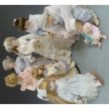 Eight various bisque headed and similar dolls, all in period clothing.