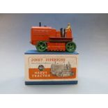Dinky Supertoys diecast model Heavy Tractor with orange body and green tracks, 563, in original box.