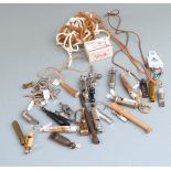 A collection of whistles to include ACME Referee, GPO example, horn whistle, baby's rattle with