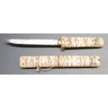 Japanese Tanto dagger with carved bone handle and scabbard depicting figures and 15.5cm blade,
